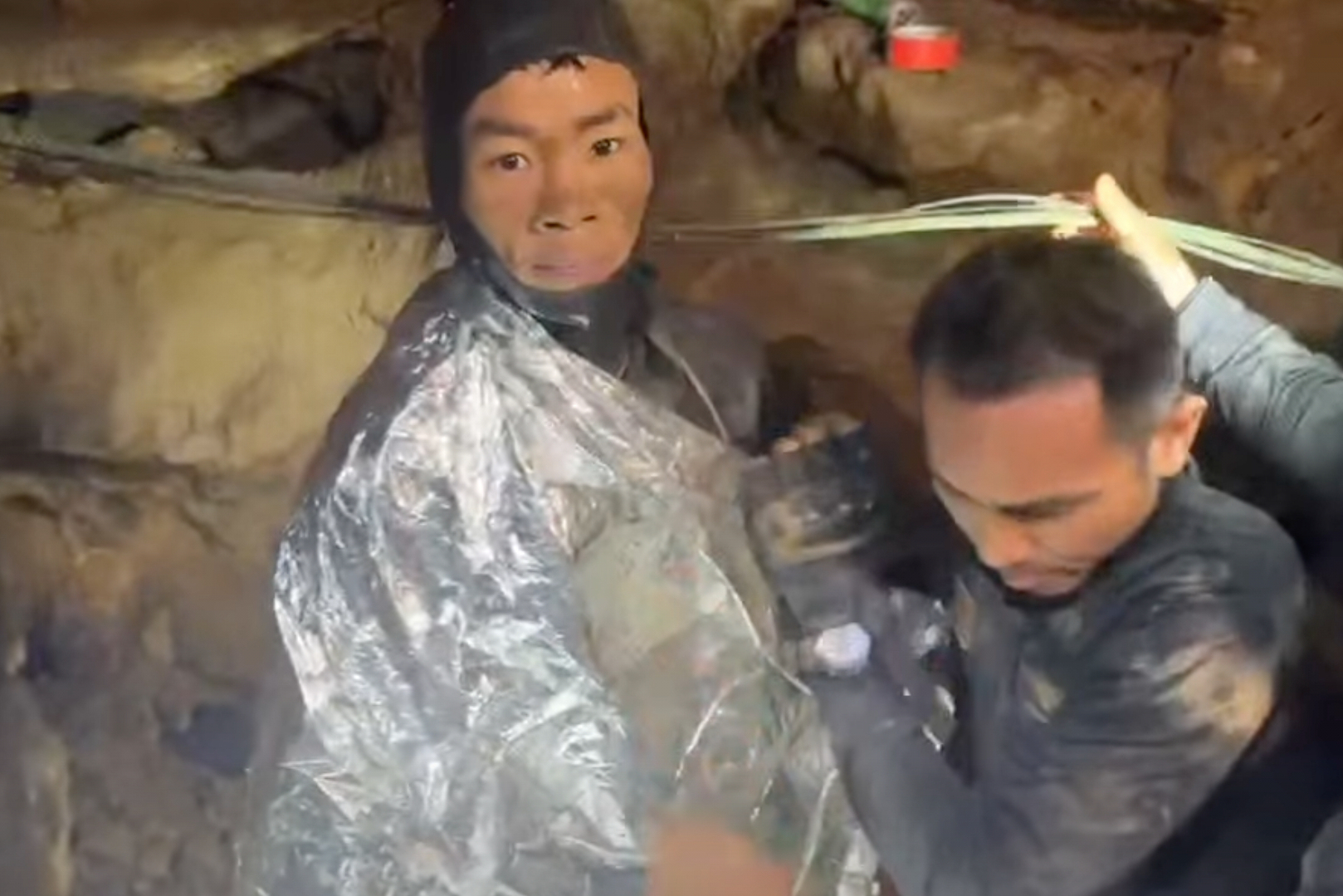 Rescuers free 4 men trapped in flooded cave in Laos, search for 2 still missing