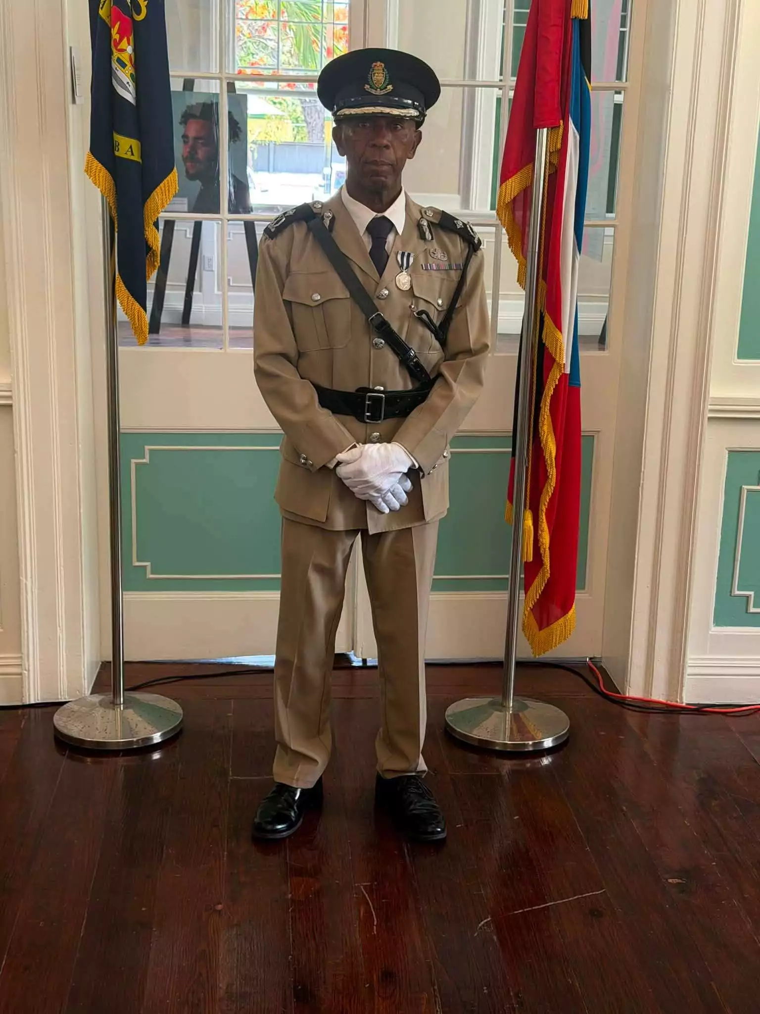 Assistant Commissioner Desmond Dinard Receives King’s Police Medal