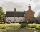 Homes for sale in England with great gardens for parties – in pictures