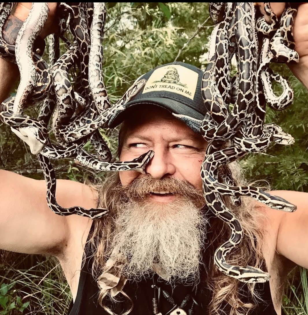 A dead python will get you a free pizza at this man's restaurant. Yes, it's in Florida